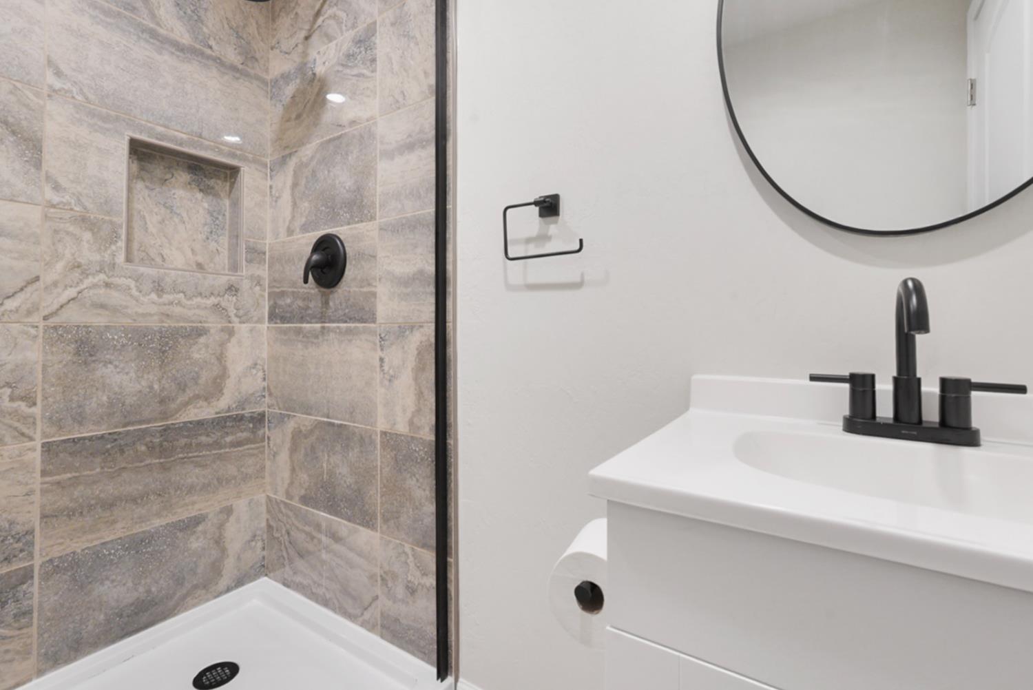 2324 Quail Hill Road Copperopolis, CA 95228 - Photo 19 of 37 a bathroom with a sink and a mirror