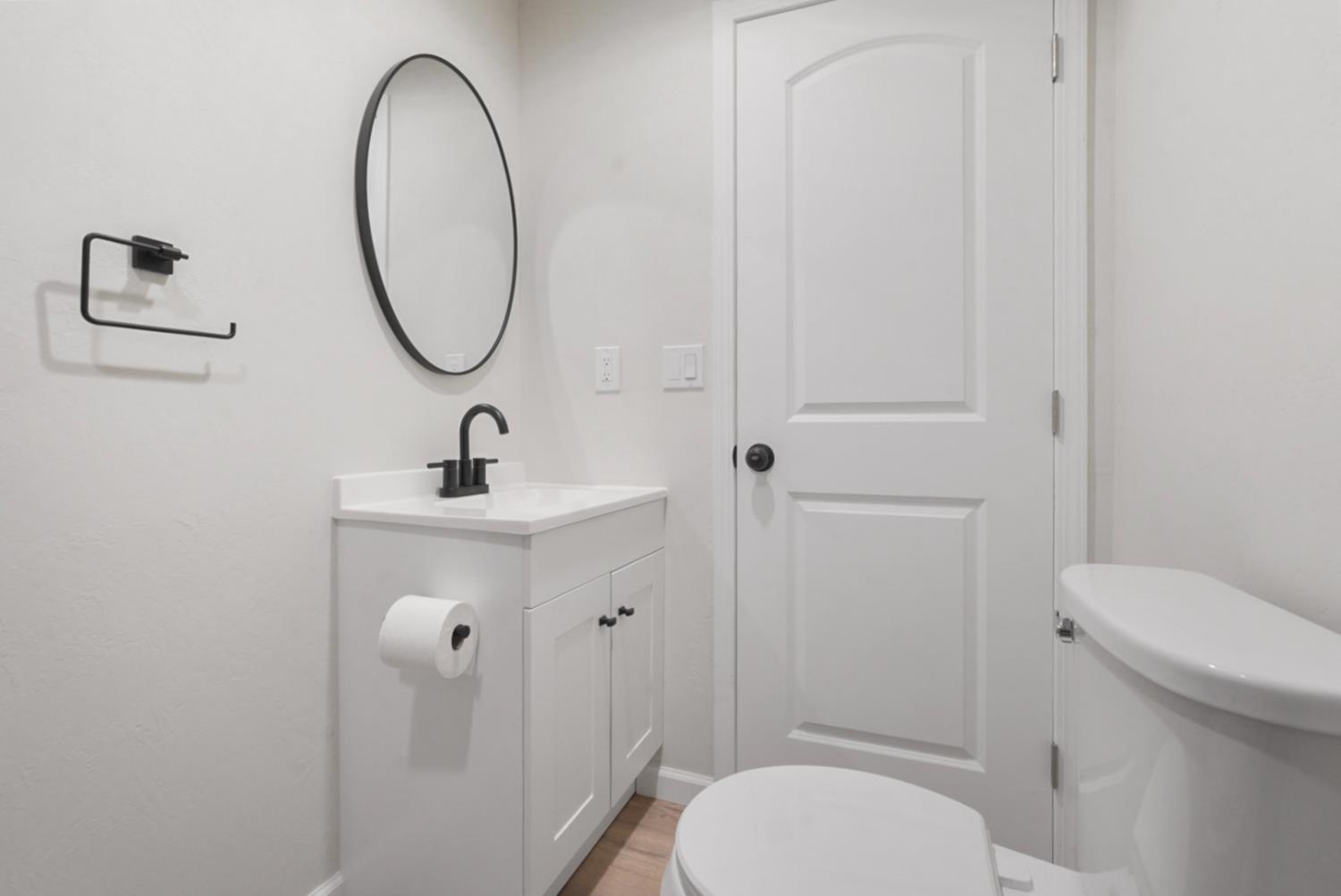 2324 Quail Hill Road Copperopolis, CA 95228 - Photo 20 of 37 a bathroom with a sink a toilet and a mirror