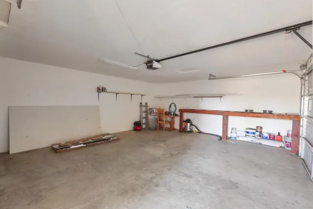 a view of living room with furniture and a painting
