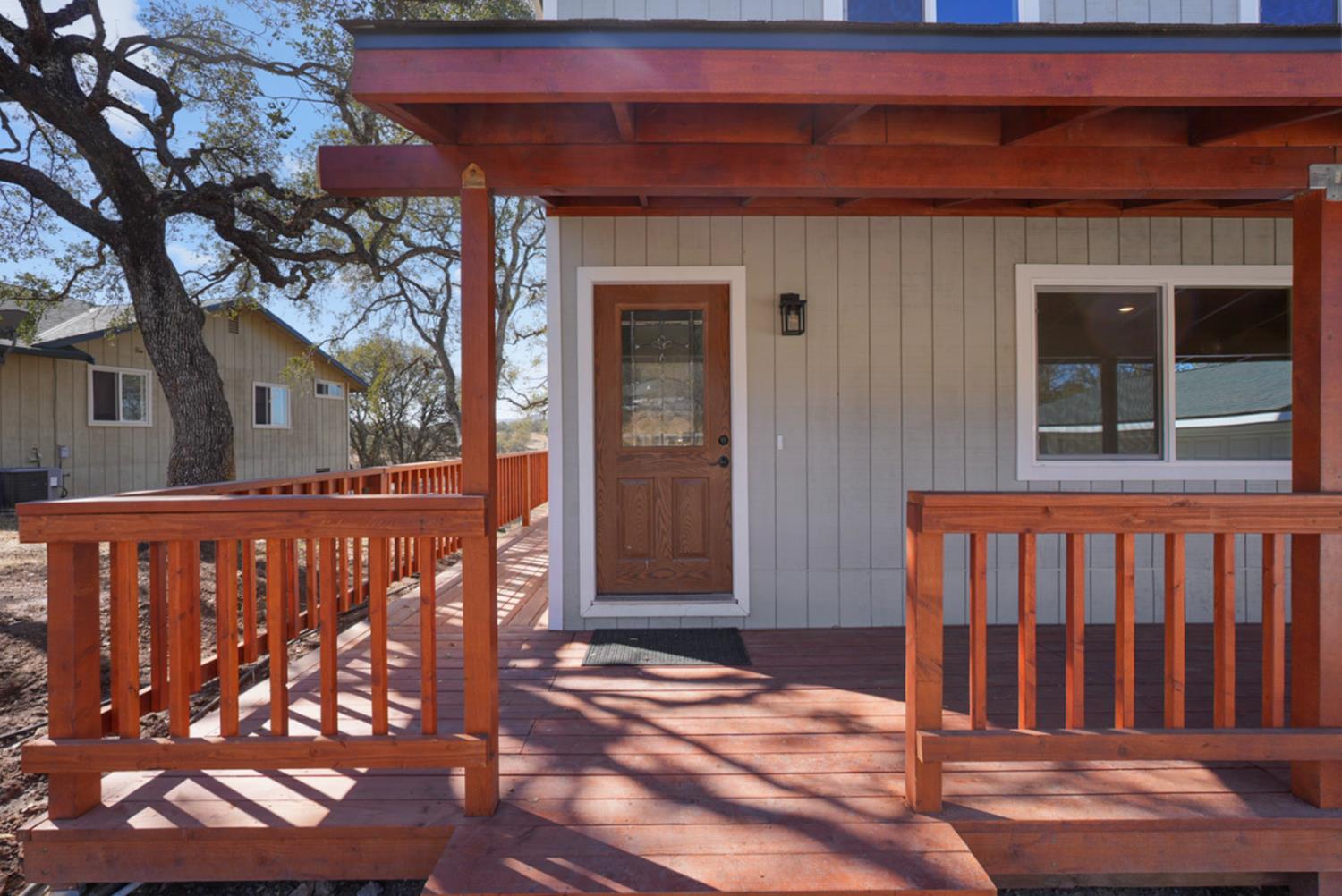 2324 Quail Hill Road Copperopolis, CA 95228 - Photo 5 of 37 a view of a brick house with a large window