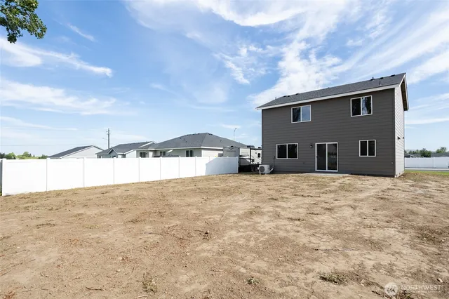 a big house with a big yard and large tree