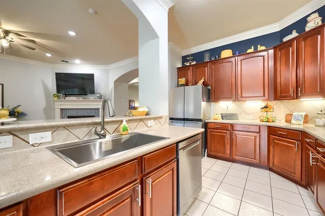 a kitchen with granite countertop a sink and cabinets