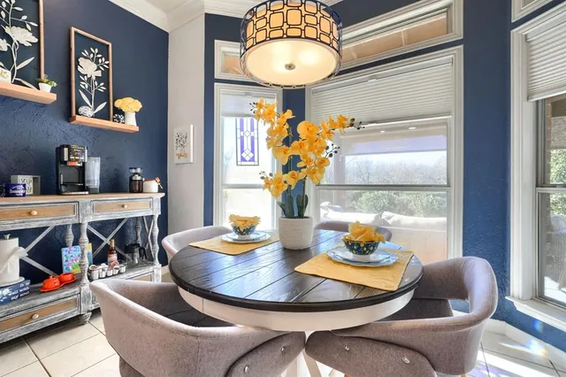 a dining room with furniture and window