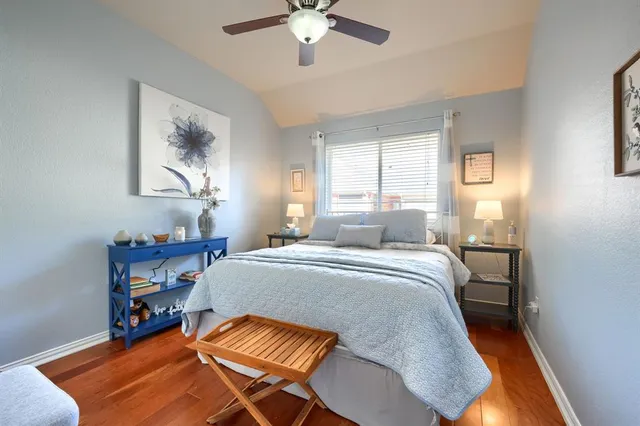 a bed room with a bed and a chandelier