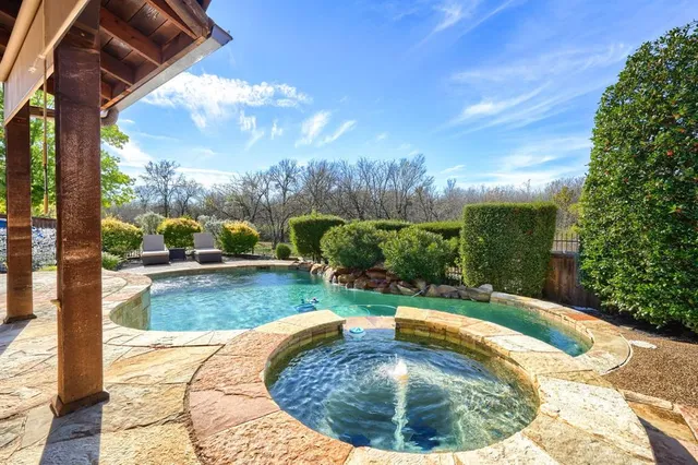 a view of a swimming pool with a sitting space