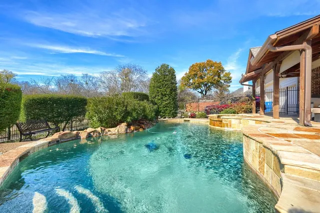 a view of swimming pool from a yard