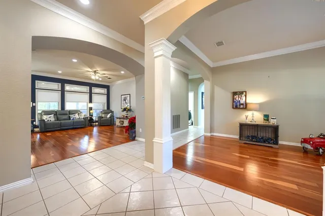 a view of a living room and kitchen