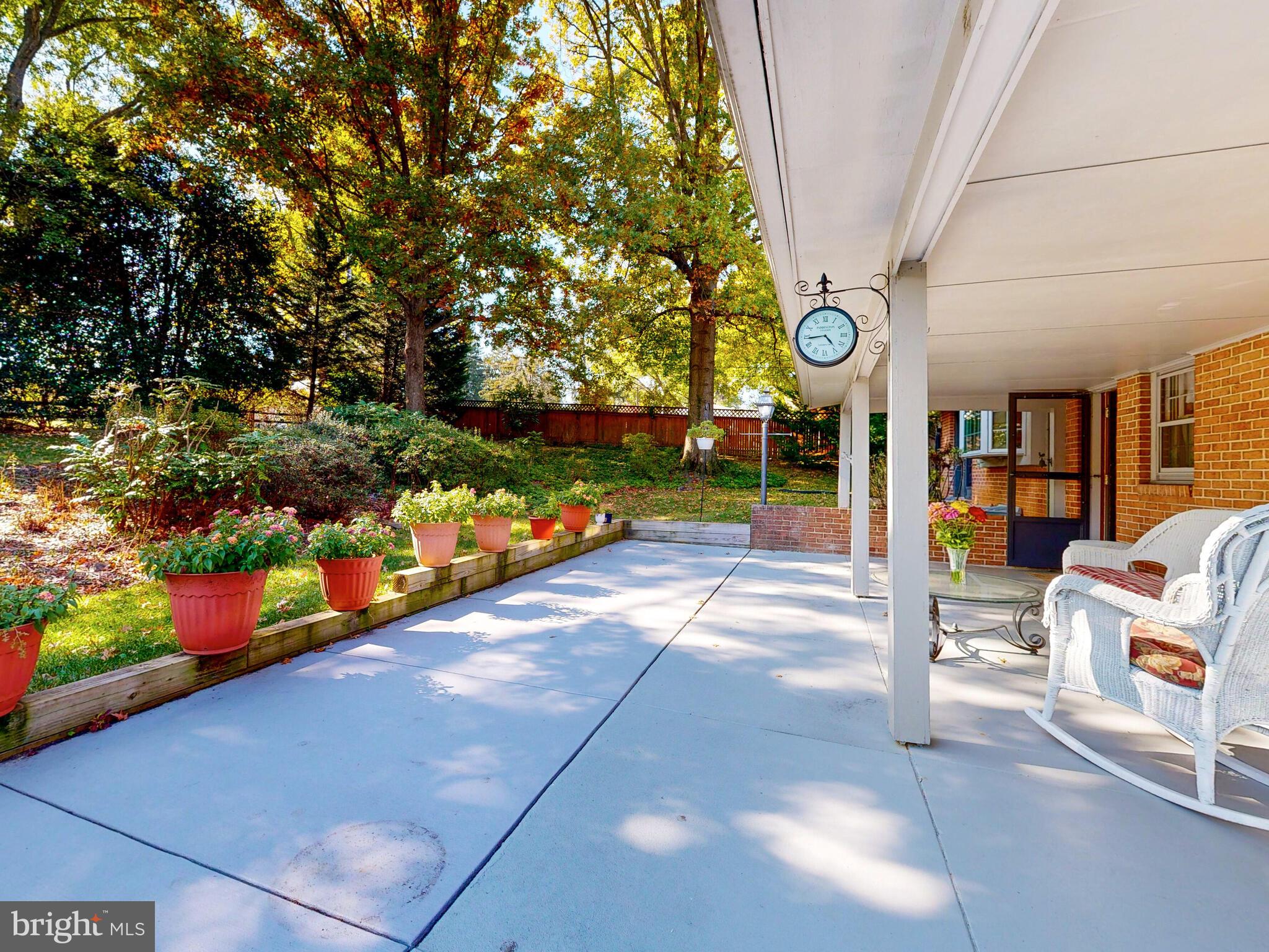 9205 Dunloggin Road Ellicott City, MD 21042 - Photo 33 of 46 Patio Surrounded by Lush and Mature Landscaping