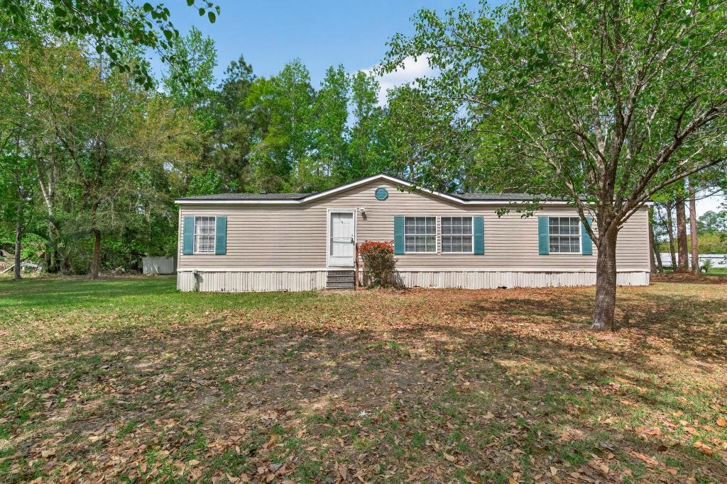 54059 Charles Street Callahan, FL 32011 - Photo 1 of 50 a view of a house with a yard