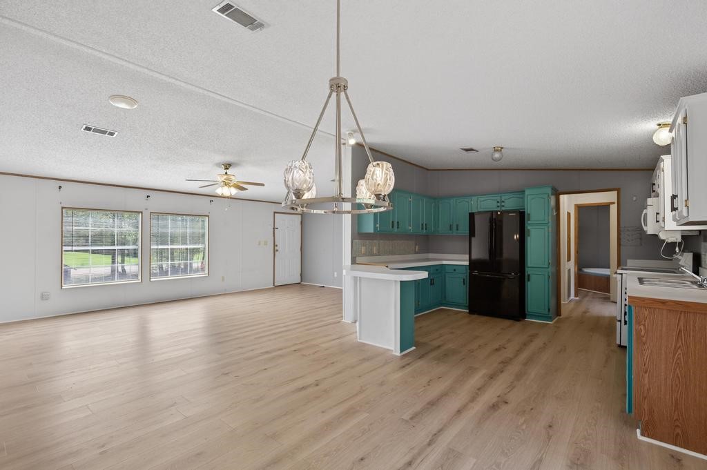 54059 Charles Street Callahan, FL 32011 - Photo 14 of 50 a view of a kitchen with wooden floor