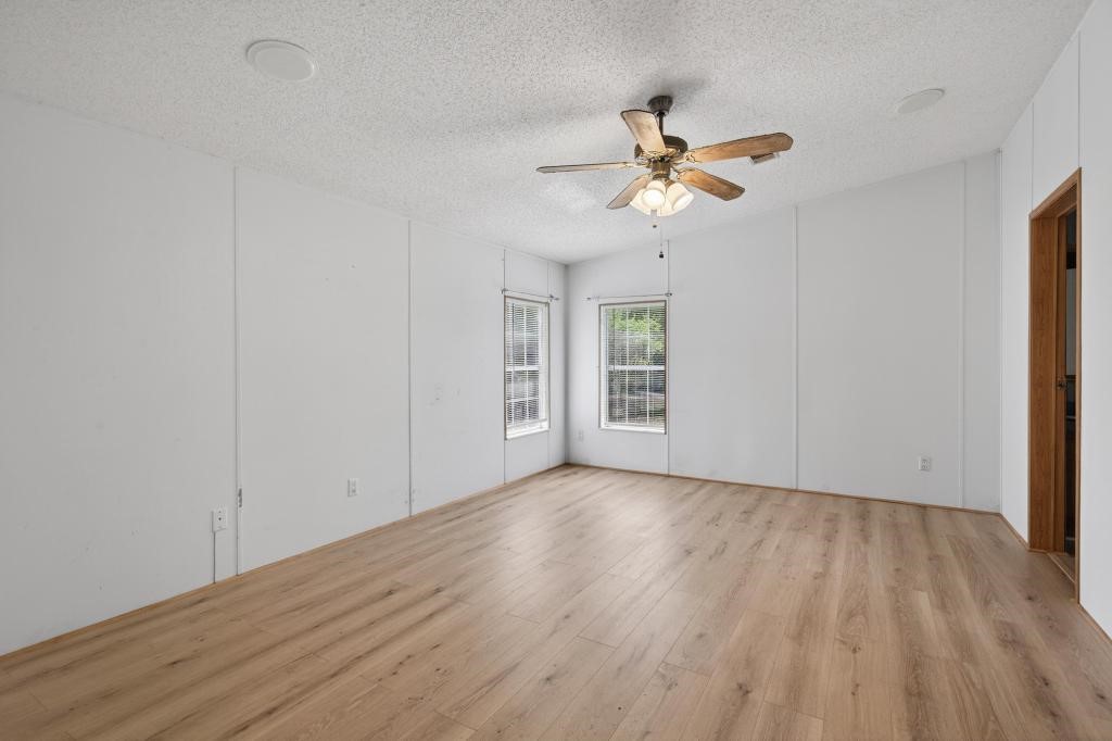 54059 Charles Street Callahan, FL 32011 - Photo 30 of 50 wooden floor in an empty room with a window