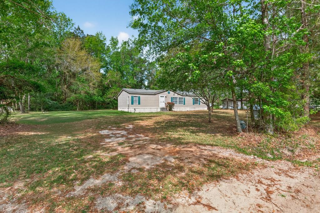 54059 Charles Street Callahan, FL 32011 - Photo 3 of 50 a house view with a outdoor space