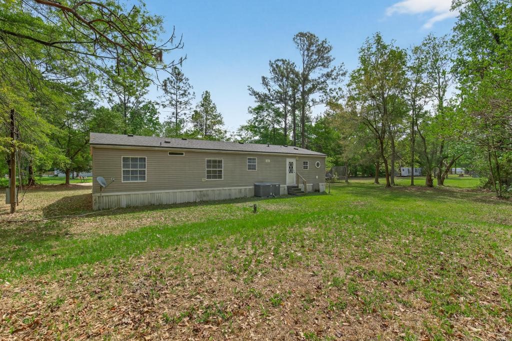 54059 Charles Street Callahan, FL 32011 - Photo 39 of 50 a view of a house with a backyard