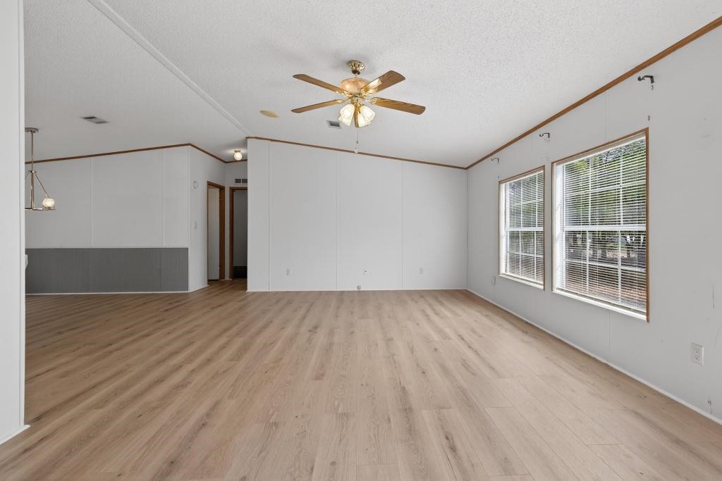 54059 Charles Street Callahan, FL 32011 - Photo 7 of 50 wooden floor in an empty room with a window