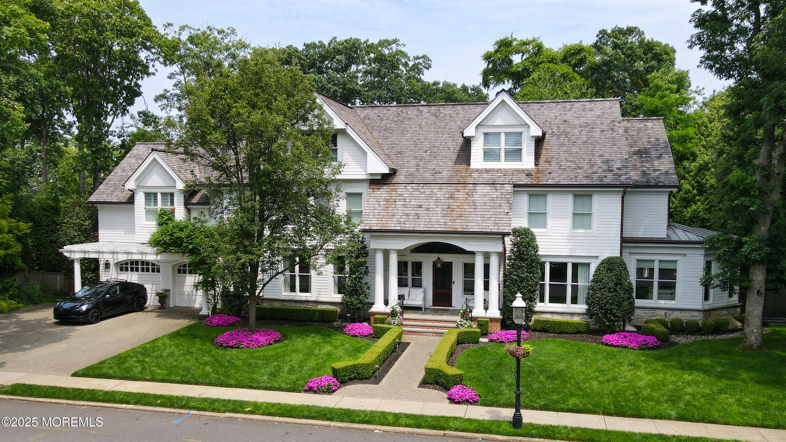 11 Red Oak Drive Spring Lake, NJ 07762 - Photo 1 of 17 a front view of a house with a big yard and potted plants