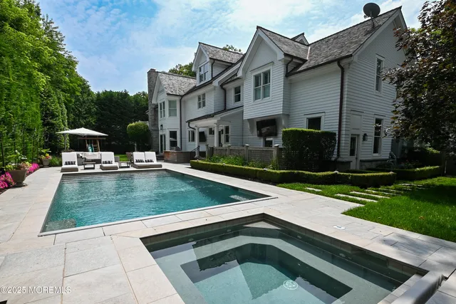 a view of a house with a sink and a yard