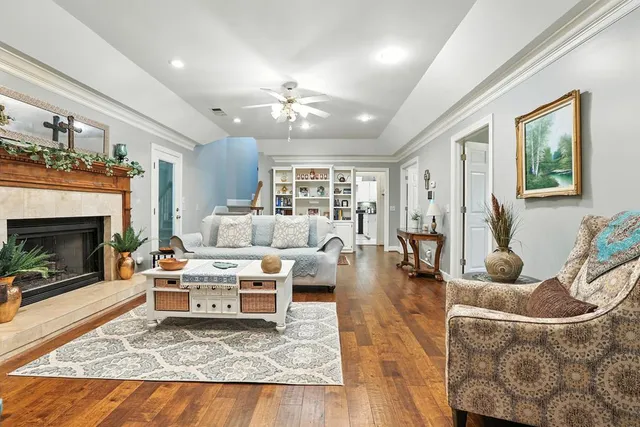a spacious bathroom with a tub sink and a mirror