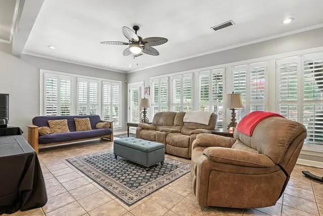 a bathroom with a granite countertop sink a toilet and a mirror