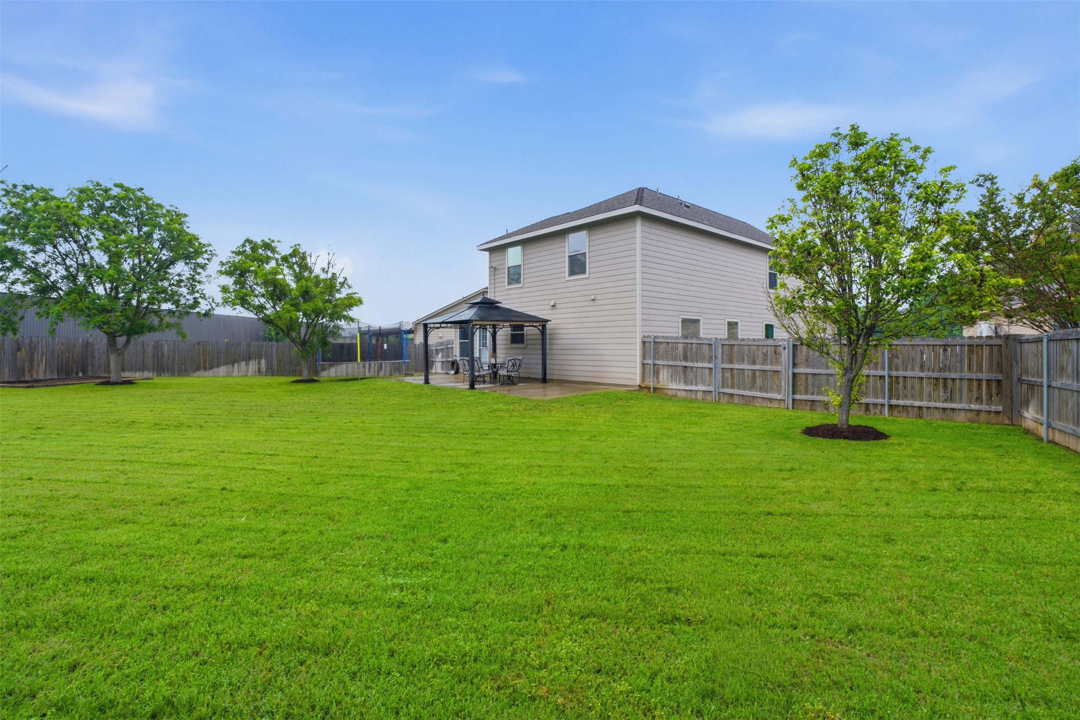 137 Barn Owl Loop Leander, TX 78641 - Photo 35 of 36 a view of a house with a yard and sitting area