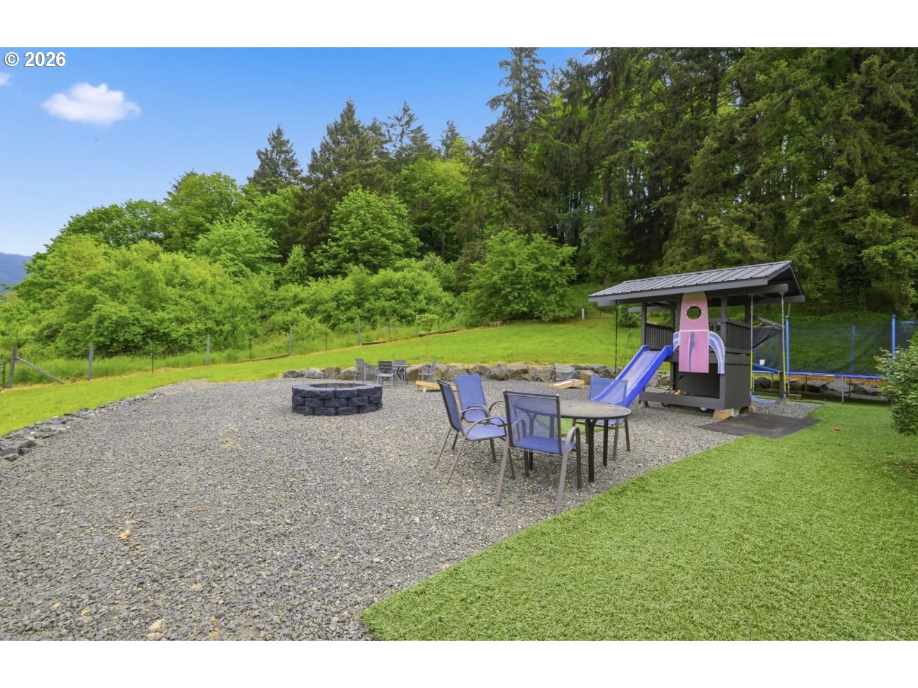 33192 Wilkins Road Eugene, OR 97408 - Photo 30 of 35 a view of a house with a yard patio and sitting area