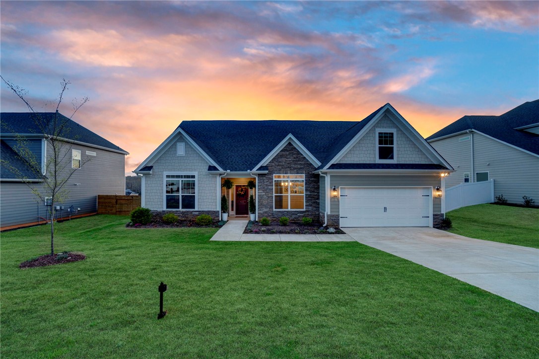 142 Juniper Hill Drive Easley, SC 29642 - Photo 3 of 47 This charming home offers a perfect blend of comfort and style under a colorful sky.