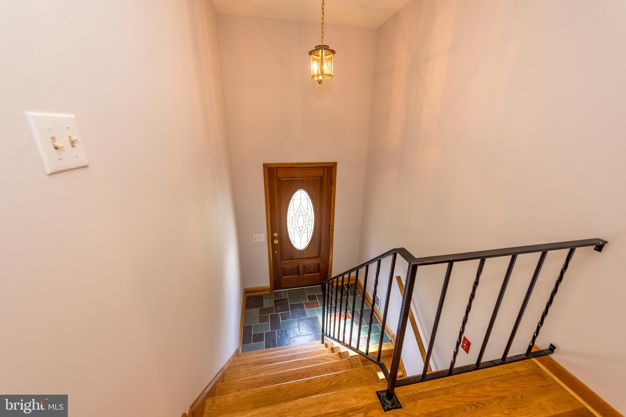 40 Telestar Way Havre de Grace, MD 21078 - Photo 3 of 33 a view of a hallway with wooden floor and white walls