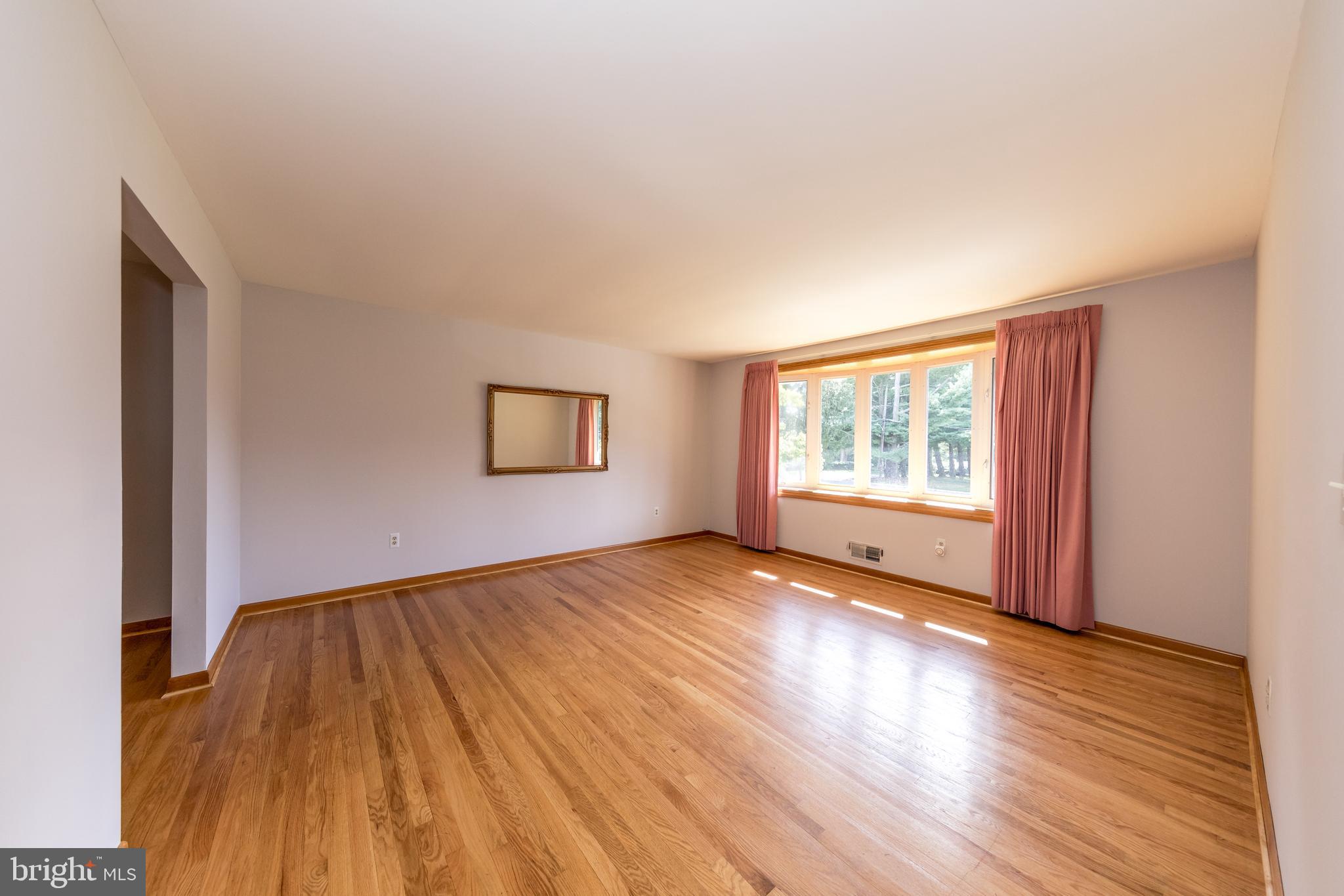 40 Telestar Way Havre de Grace, MD 21078 - Photo 4 of 33 a view of an empty room with wooden floor and a window
