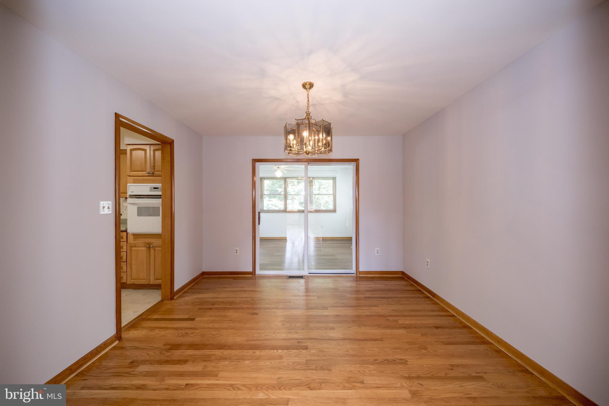 40 Telestar Way Havre de Grace, MD 21078 - Photo 6 of 33 a view of an empty room with wooden floor and a window