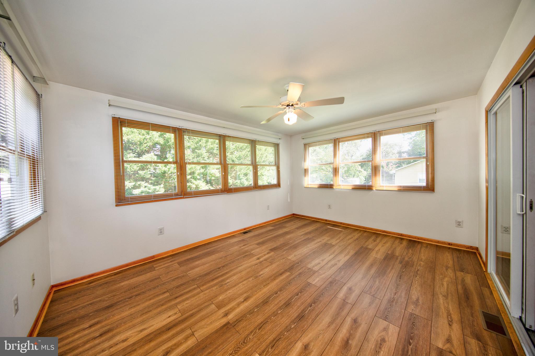 40 Telestar Way Havre de Grace, MD 21078 - Photo 8 of 33 a view of an empty room with wooden floor and a window