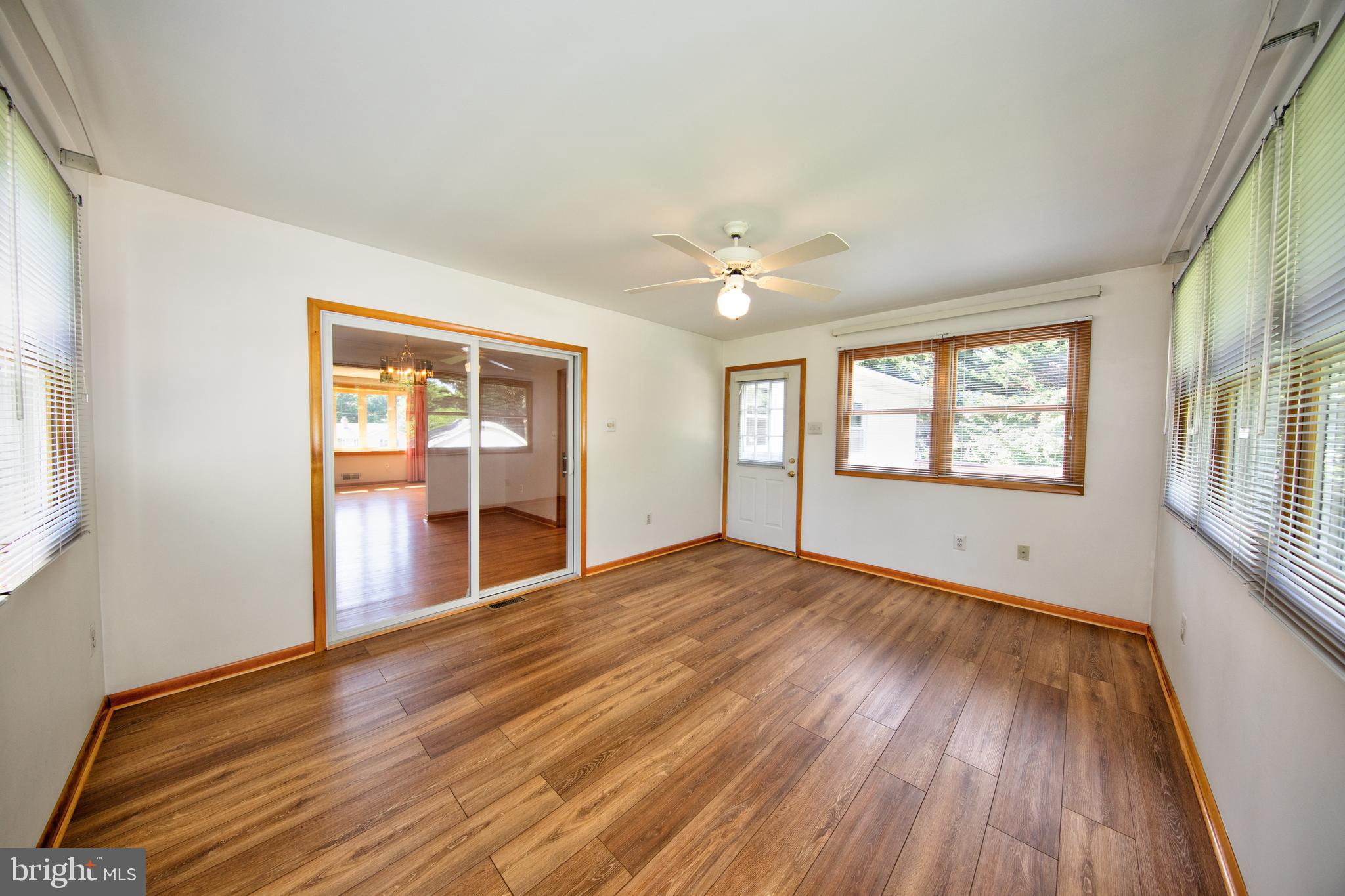 40 Telestar Way Havre de Grace, MD 21078 - Photo 9 of 33 a view of an empty room with a window and wooden floor
