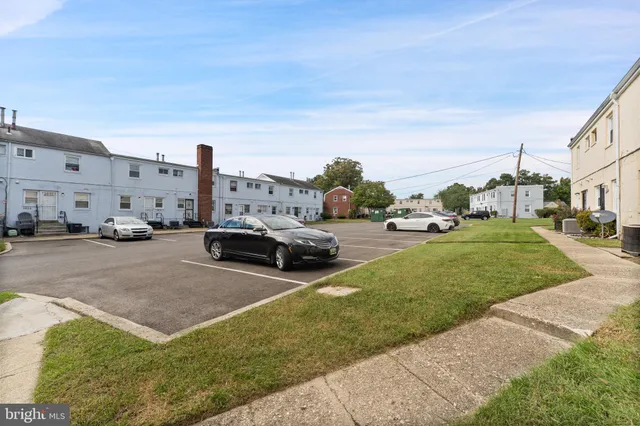 a view of yard with cars