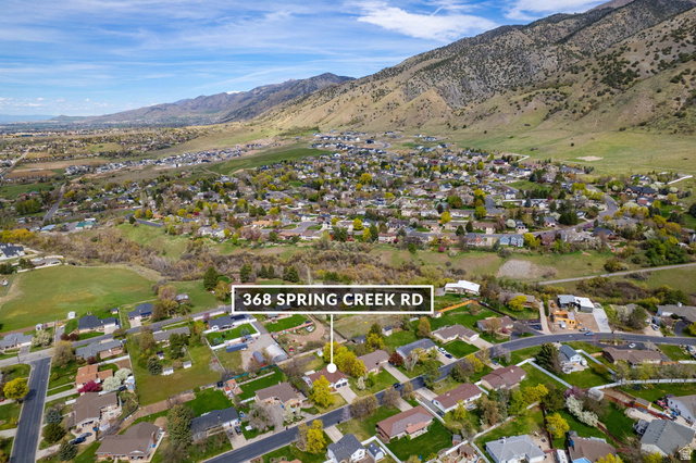 368 Spring Creek Road Providence, UT 84332 - Photo 42 of 45 Aerial perspective of suburban area with a mountainous background and property parcel outlined