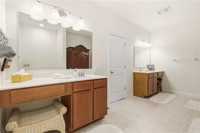 a bathroom with a sink double vanity and a mirror