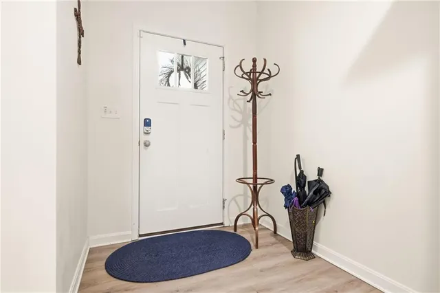 a view of a room with a table and a chandelier