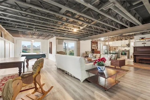 a living room with furniture and a chandelier