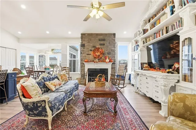 a living room with furniture fireplace and window