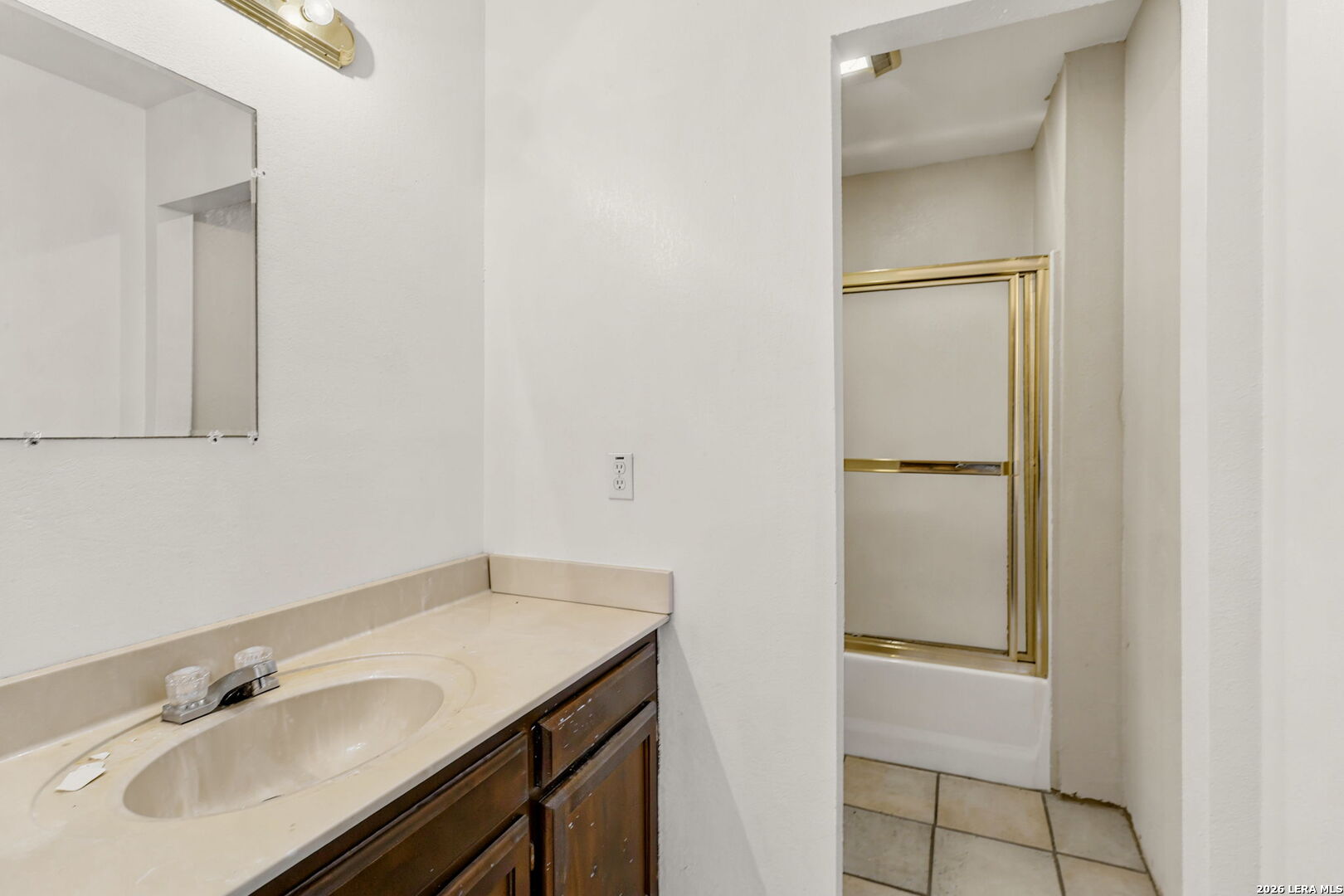 3061 Horse Ranch Road San Antonio, TX 78264 - Photo 20 of 34 a bathroom with a sink and a mirror