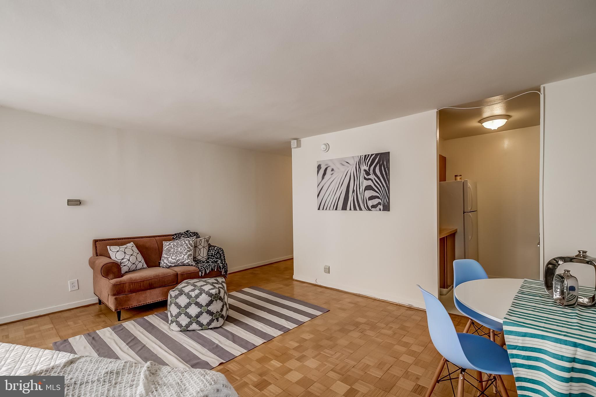 224-30 West Rittenhouse Square, Unit 2604 Philadelphia, PA 19103 - Photo 3 of 21 a living room with furniture and a wooden floor