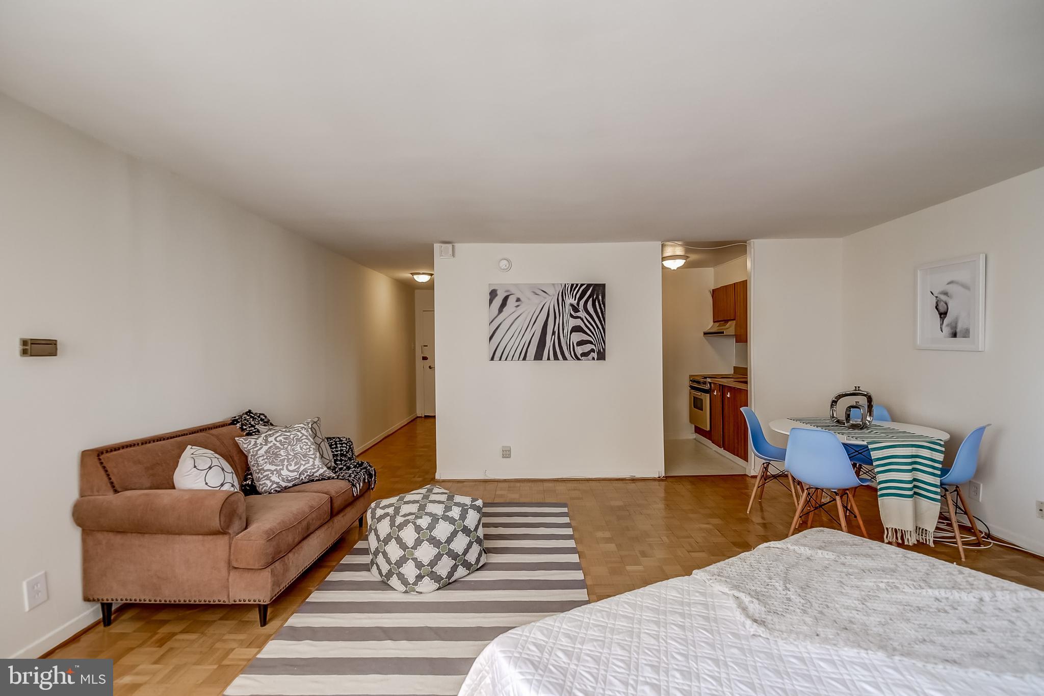 224-30 West Rittenhouse Square, Unit 2604 Philadelphia, PA 19103 - Photo 4 of 21 a bedroom with furniture and a wooden floor