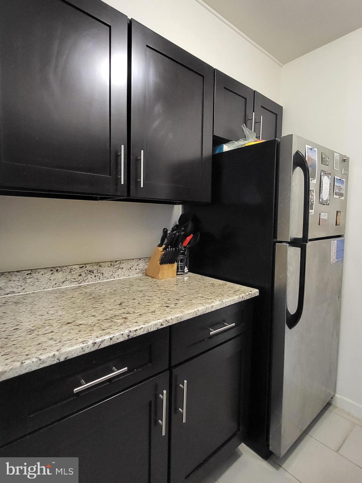 224-30 West Rittenhouse Square, Unit 2604 Philadelphia, PA 19103 - Photo 6 of 21 a kitchen with a sink and refrigerator