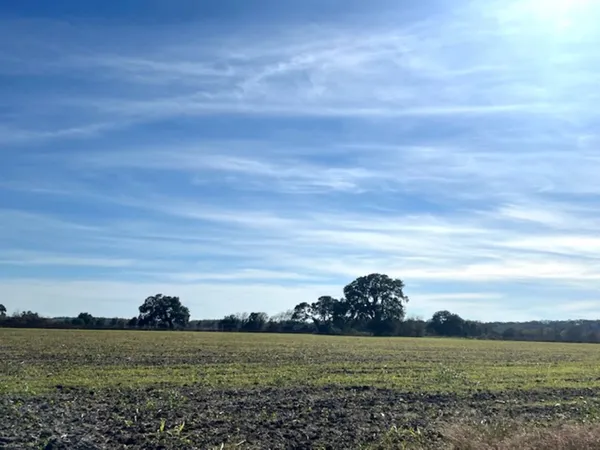 a view of a ocean with a building in the background