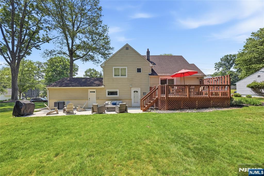 77 White Pond Road Waldwick, NJ 07463 - Photo 32 of 33 a view of a house with a yard and sitting area