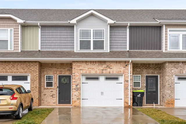 a front view of a house with a garage