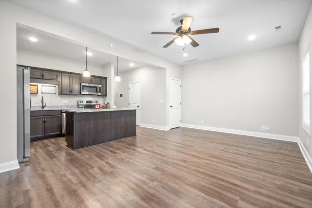 a view of kitchen with wooden floor and window