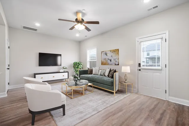 a living room with furniture and a flat screen tv