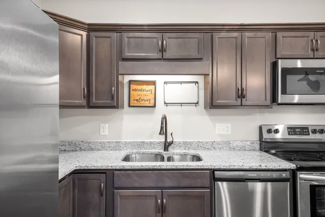 a kitchen with a sink and cabinets