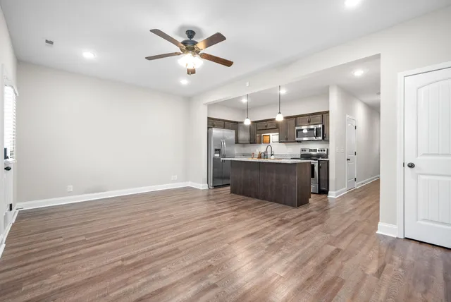 a view of kitchen with wooden floor