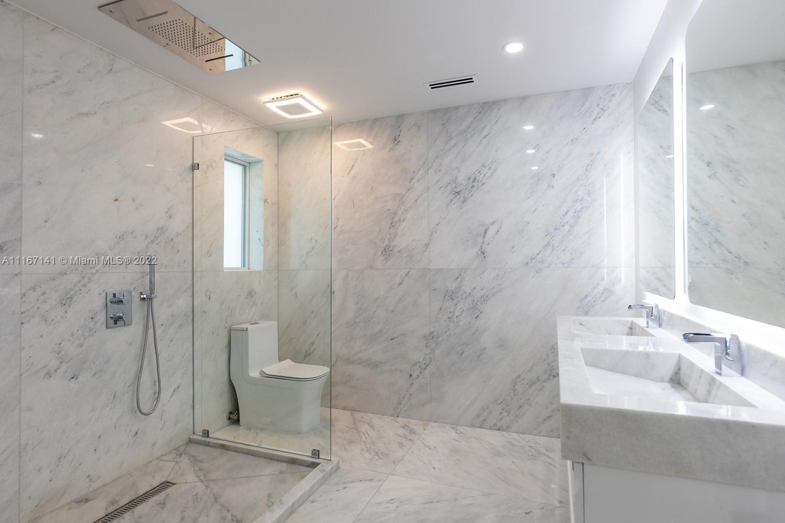 4730 Bay Point Road Miami, FL 33137 - Photo 11 of 25 a bathroom with a sink a toilet and shower