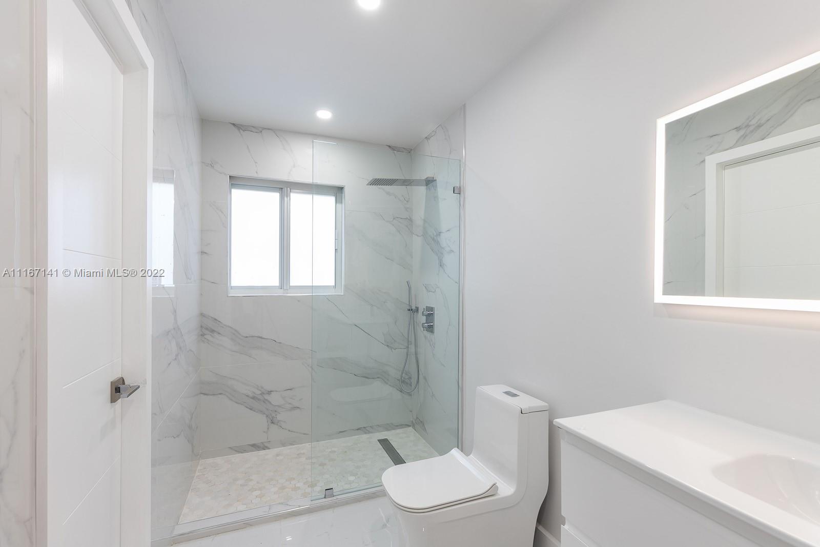 4730 Bay Point Road Miami, FL 33137 - Photo 15 of 25 a bathroom with a toilet and shower