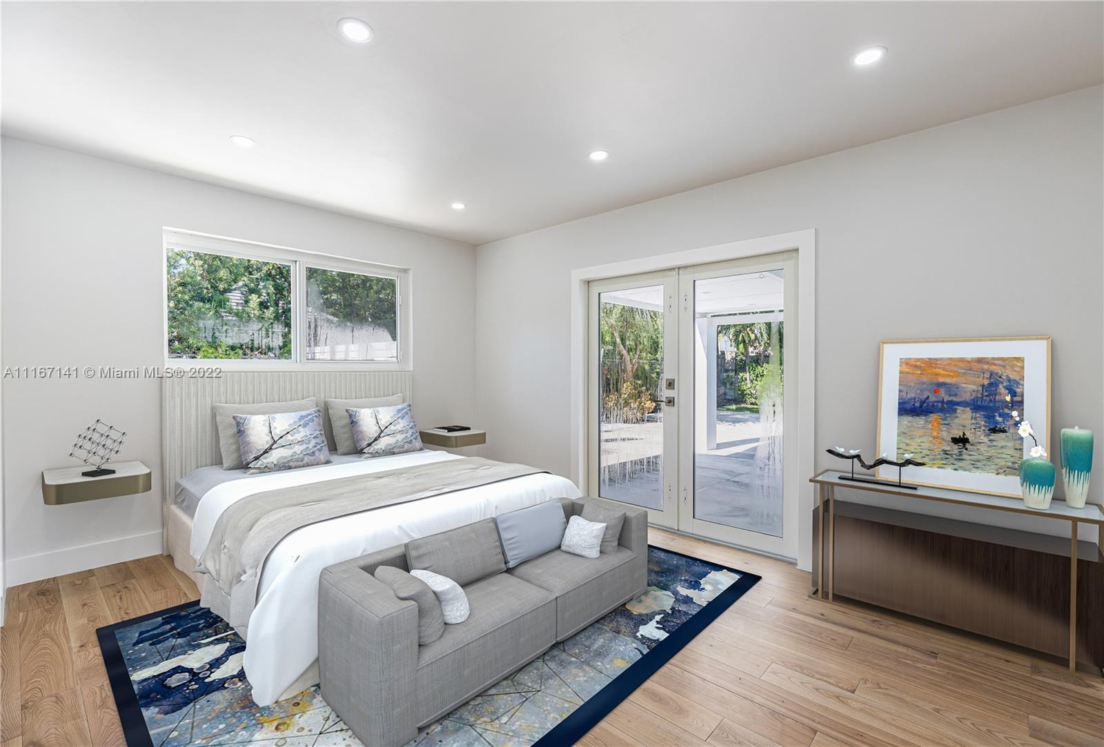 4730 Bay Point Road Miami, FL 33137 - Photo 20 of 25 a bedroom with a bed and a large window